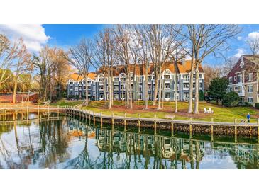 Waterfront community with multiple buildings and a boardwalk at 703 Southwest Dr, Davidson, NC 28036