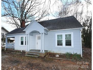 Charming light blue house with white trim and a welcoming front porch at 1909 2Nd Sw Ave, Hickory, NC 28602