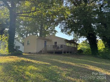 Ranch home with deck, shaded yard, and mature trees at 503 N Boyce St, Gastonia, NC 28052