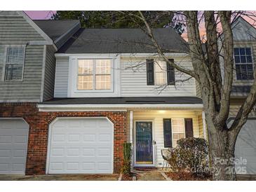 Inviting exterior of charming townhome with brick and siding at 11507 Delores Ferguson Ln, Charlotte, NC 28277