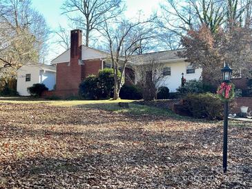 Brick Ranch house with a large backyard and mature trees at 511 W Stevens Dr, Kershaw, SC 29067