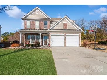 Two-story house with two-car garage and landscaped lawn at 4115 Stuart Ln, Indian Land, SC 29707