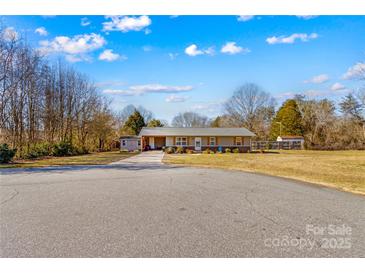 Ranch style home with covered porch and landscaped yard at 111 Lois Ct, Statesville, NC 28625