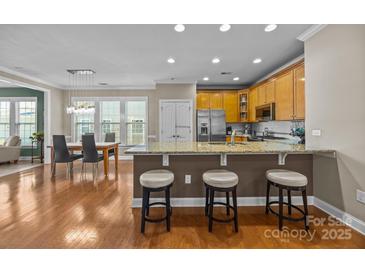 Modern kitchen with stainless steel appliances and granite countertops at 18119 Coulter Pkwy, Cornelius, NC 28031