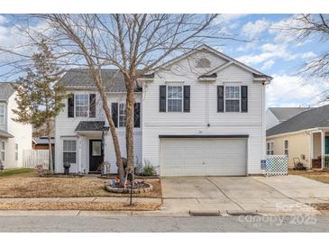 Two-story house with attached garage and landscaping at 2219 Kirkgate Ln, Charlotte, NC 28215