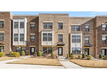 Modern brick townhome with front yard landscaping at 513 Nantahala Dr, Charlotte, NC 28211