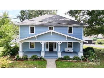 Charming blue two-story house with a front porch at 315 9Th Sw St, Conover, NC 28613