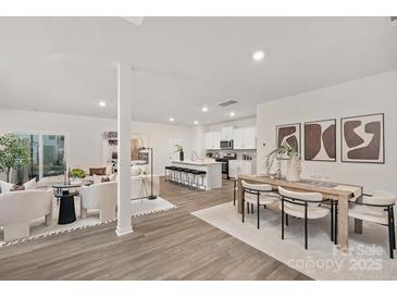 Bright, open-concept living space with modern finishes seamlessly connects living, dining, and kitchen areas at 384 Bly St, Rock Hill, SC 29732