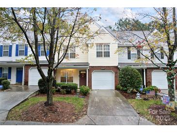 Attractive brick townhouse with 2-car garage and landscaping at 9907 Reindeer Way Ln, Charlotte, NC 28216