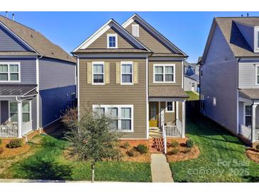 Two-story craftsman style home with neutral exterior and front porch at 11307 Miller Rd # 101, Pineville, NC 28134