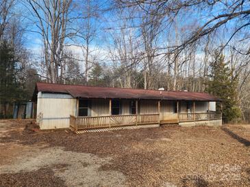 Single-story home with a long front porch and wooded setting at 4766 Dolph Monroe Rd, Maiden, NC 28650