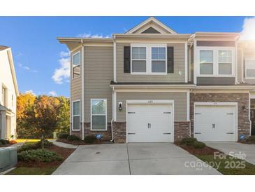 Stylish townhouse with a two-car garage and neutral siding at 620 Altamonte Dr, Clover, SC 29710