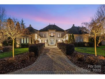 Elegant two-story home with stone accents and landscaped grounds at 3042 Kings Manor Dr, Weddington, NC 28104