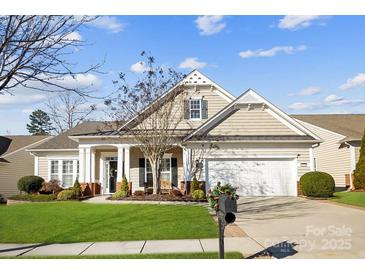 Beautiful two-story home with a charming front porch and well-manicured lawn at 7252 Shenandoah Dr, Fort Mill, SC 29707