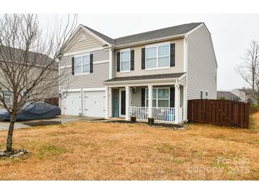 Two-story house with a two-car garage and a landscaped yard at 11677 Striker Ln, Midland, NC 28107