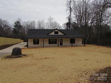 Newly constructed home with a charming front porch and landscaped yard at 3720 Turner Rd, Clover, SC 29710