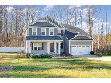 Two-story house with gray siding, white trim, and a two-car garage at 159 Charles Farm Dr, Cleveland, NC 27013