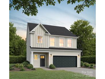 Two-story home with a neutral color scheme and a two-car garage at 3020 Sadler Woods Ln, Charlotte, NC 28214