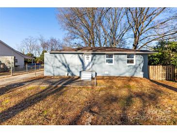 Newly renovated light blue single story home with a well-manicured lawn at 5528 Queen Anne Rd, Charlotte, NC 28217