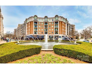 Upscale condo building with fountain and shops at 4620 Piedmont Row Dr # 509, Charlotte, NC 28210