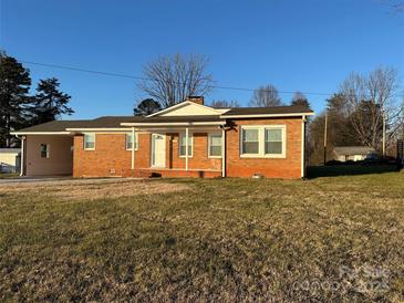 Brick ranch home with covered porch and large yard at 648 Scotts Creek Rd, Statesville, NC 28625