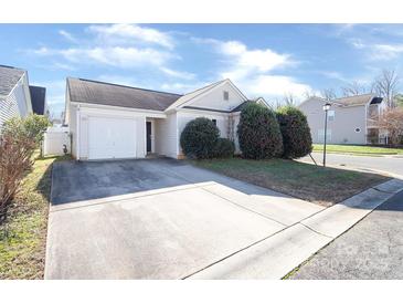 Ranch home with attached garage and well-manicured landscaping at 13502 Tartarian Ct, Charlotte, NC 28215