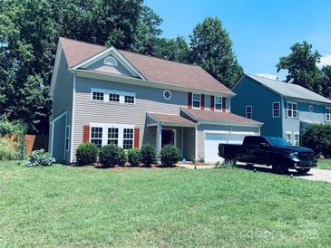 Charming two-story home with gray siding, red shutters, and a well-manicured lawn at 9624 Langston Mill Rd, Charlotte, NC 28216