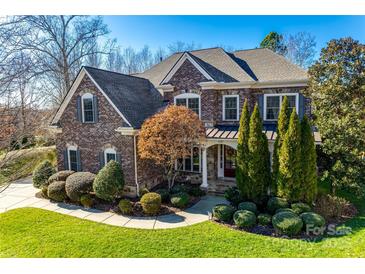 Brick two-story house with landscaped lawn and walkway at 1257 Stacey Ln, Indian Land, SC 29707