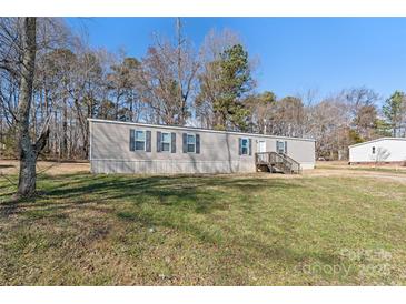 Charming single-story home with gray siding, black shutters and front yard at 1805 Drew Dr, Lincolnton, NC 28092