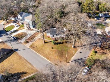 House located on a corner lot with mature trees and a quiet street at 2601 Columbus Cir, Charlotte, NC 28208