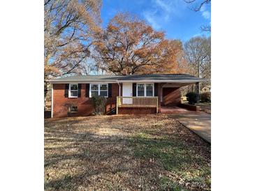 Brick ranch house with new wooden steps and landscaping at 1325 Eastview Ext, Shelby, NC 28152