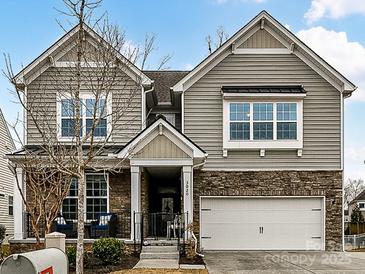 Two-story house with stone accents and a two-car garage at 3020 Sewee Ln, Waxhaw, NC 28173