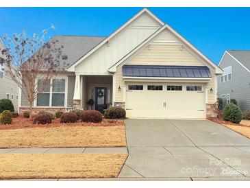 Craftsman style home with two-car garage and landscaped yard at 5021 Redwood Grove Trl # 86, Lancaster, SC 29720