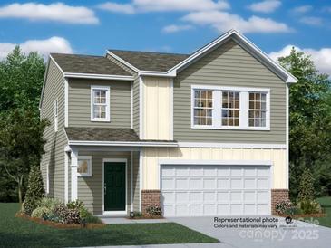 Two-story home with green door and attached garage at 113 Mountain Bridge Way, Statesville, NC 28625