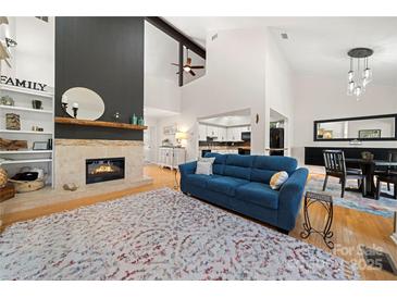 Open living area with fireplace and view of dining area at 204 Riverview Ter, Lake Wylie, SC 29710
