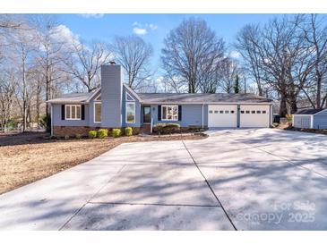 Ranch style home with attached two-car garage and spacious driveway at 217 E Old Highway 74 Hwy # 4, Monroe, NC 28112