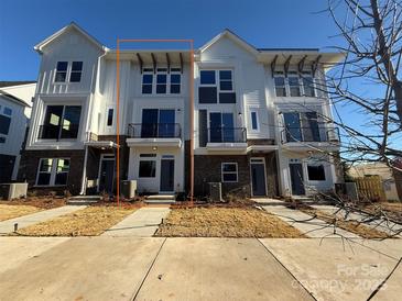 Modern three-story townhome with attached garage and private balcony at 1225 E 34Th St # Csw0419, Charlotte, NC 28205