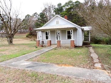 Charming one-story house with a front porch and brick accents at 374 Zion Church Rd, Mount Gilead, NC 27306