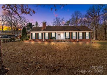 Brick ranch house with green shutters, front steps, and a spacious lawn at 44339 Us 52 N Hwy, Richfield, NC 28137