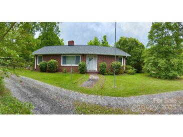 Brick ranch house with a gravel driveway and walkway at 931 Skyline Dr, Chester, SC 29706