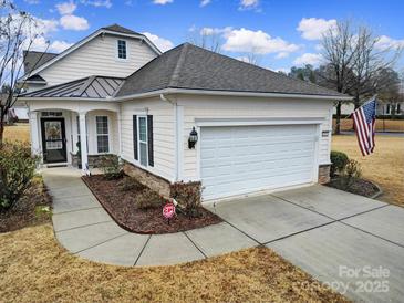 Craftsman style home with attached garage and manicured lawn at 3935 Yosemite Way, Fort Mill, SC 29707