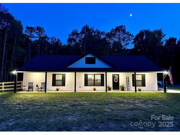 Charming one story home with welcoming front porch and a 'Welcome' sign on the front door at 2227 Charlotte Hwy, York, SC 29745