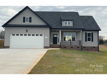 Charming gray two-story home featuring a spacious two-car garage and landscaped front yard at 208 Beths Ct # 35, York, SC 29745