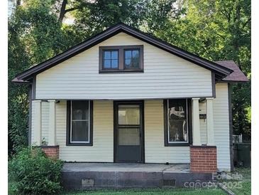 Charming yellow bungalow fixer-upper with front porch at 330 Green St, Rock Hill, SC 29730