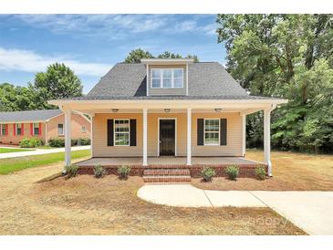 Charming home with a welcoming front porch and black shutters at 1323 Christopher Cir, Rock Hill, SC 29730