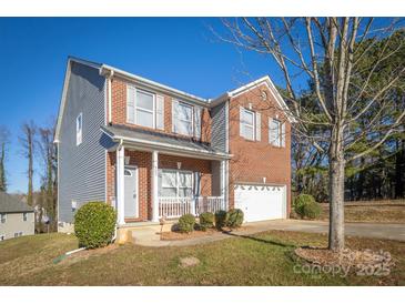 Brick and gray two-story house with a double garage at 105 Fleishhacker Pl, Mooresville, NC 28117