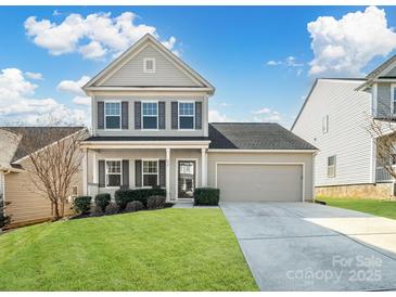 Charming two-story home with manicured lawn, attached garage, and classic curb appeal at 490 Melvista Ave, Rock Hill, SC 29732