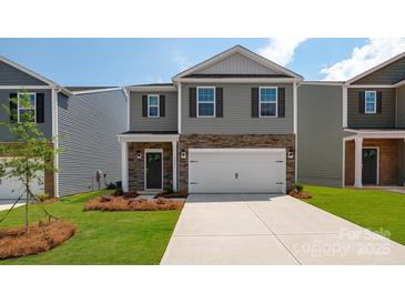Two-story house with gray siding, stone accents, and a two-car garage at 1024 20Th Avenue Se Way, Hickory, NC 28602