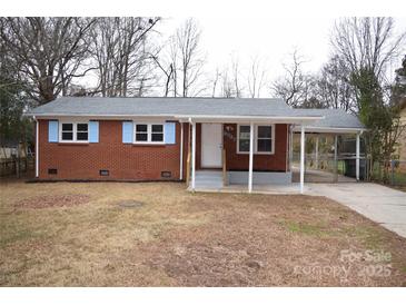 Brick ranch house with covered porch and carport at 9737 Feldbank Dr # 7, Charlotte, NC 28216