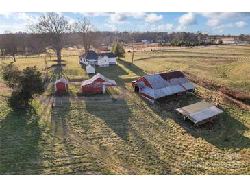 Aerial view of a house, barn, and other outbuildings on a large property at 956 Stony Point Rd, Kings Mountain, NC 28086